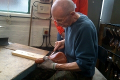 Hand finishing a high end saddle