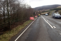The road was closed beside Torside Reservoir